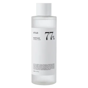 Clear glass bottle of ANUA Heartleaf 77% Soothing Toner (250ml) on white background, filled with transparent liquid. Label highlights “77% Heartleaf Extract” and “For Sensitive Skin.” Ideal for acne-prone or irritated skin in tropical climates—reduces redness, balances oil, and preps for flawless hydration.
