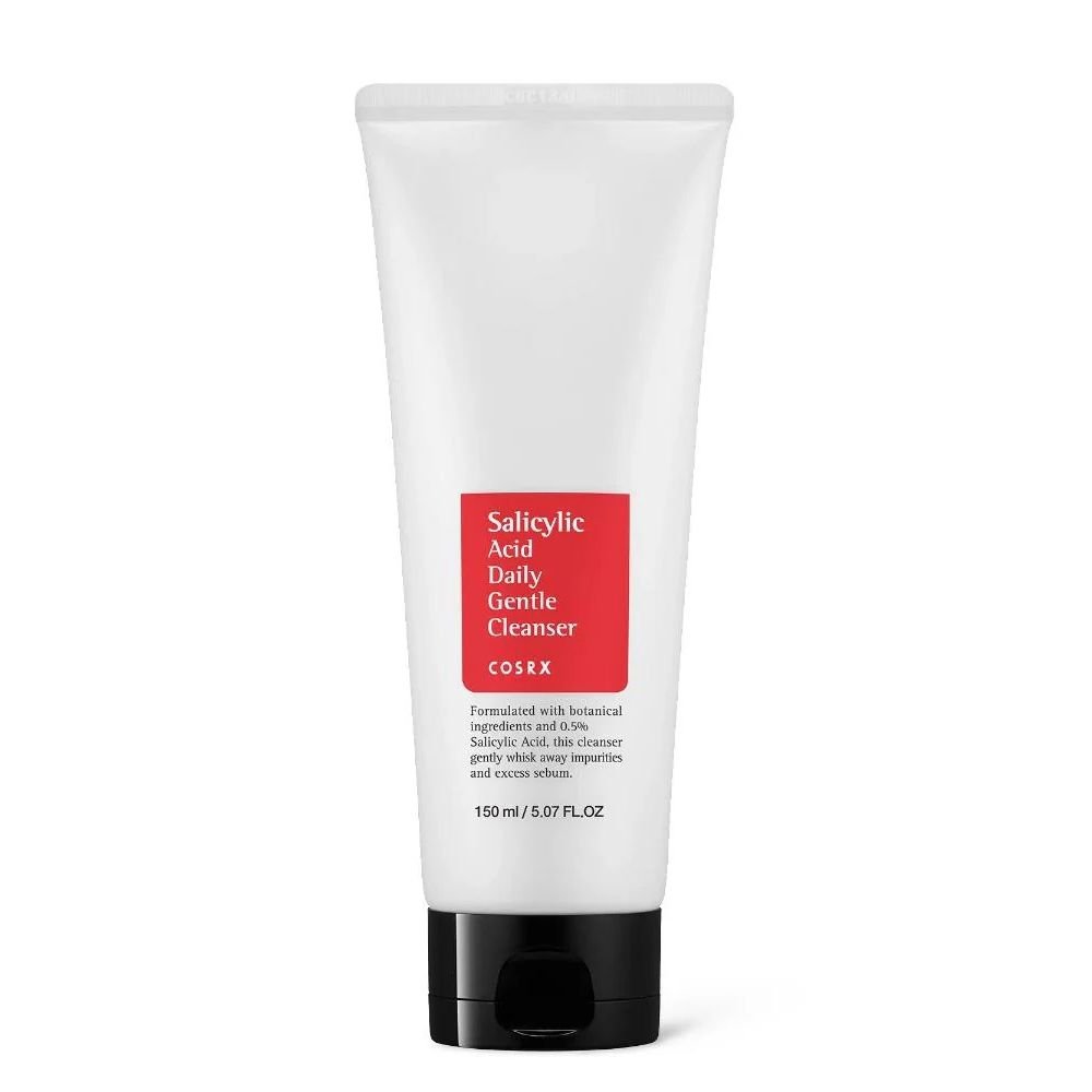 COSRX Salicylic Acid Daily Gentle Cleanser (150ml pump bottle) on white background. Label highlights "0.5% BHA," "Tea Tree Oil," and "Gentle Exfoliation." Ideal for oily, acne-prone skin in tropical climates like Ghana.