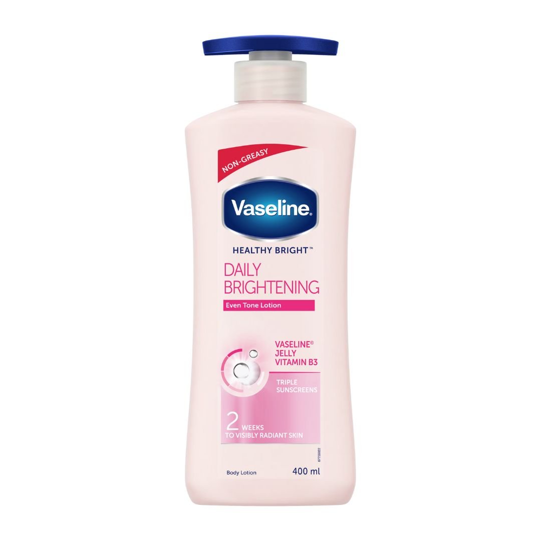 Vaseline Healthy Bright Daily Brightening Body Lotion 400 ml bottle standing on a white background, showing pink-labelled packaging that highlights Vitamin B3, Vaseline Jelly, and triple sunscreen benefits.